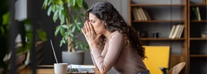 An employee is stressed after the bank withholds a large percentage of her company's funds