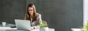 Businesswoman typing on computer