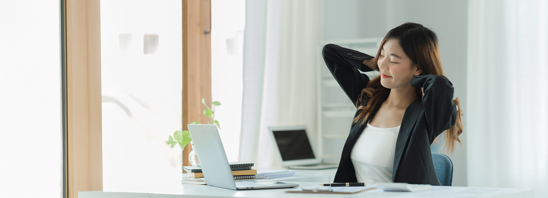 Accountant relaxing at computer desk